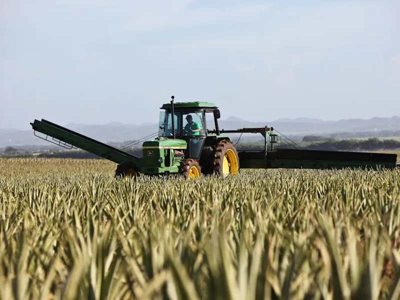 Agricultural tractor ploughing farmland in rural Zambia